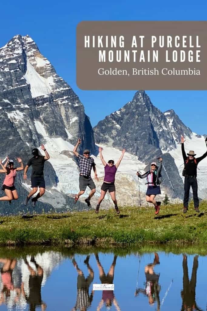 hikers jumping in front of mountains at purcell mountain lodge