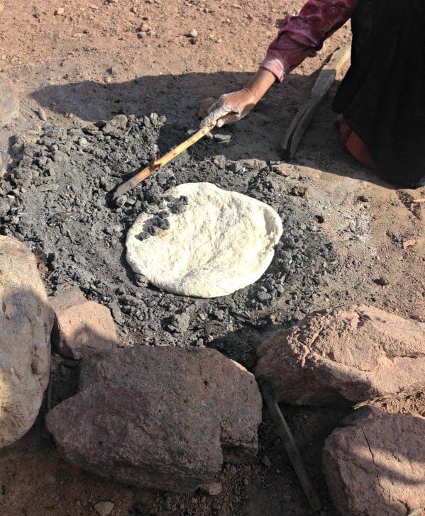 Baking abud -Bedouin bread - in ash.