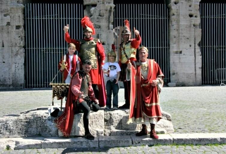boys posting with roman gladiator actors in rome