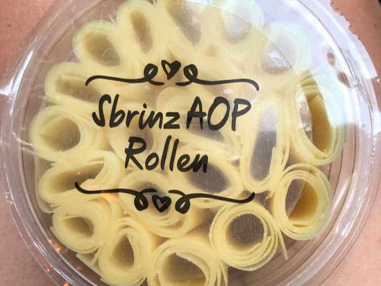rolled sbrinz cheese in plastic package