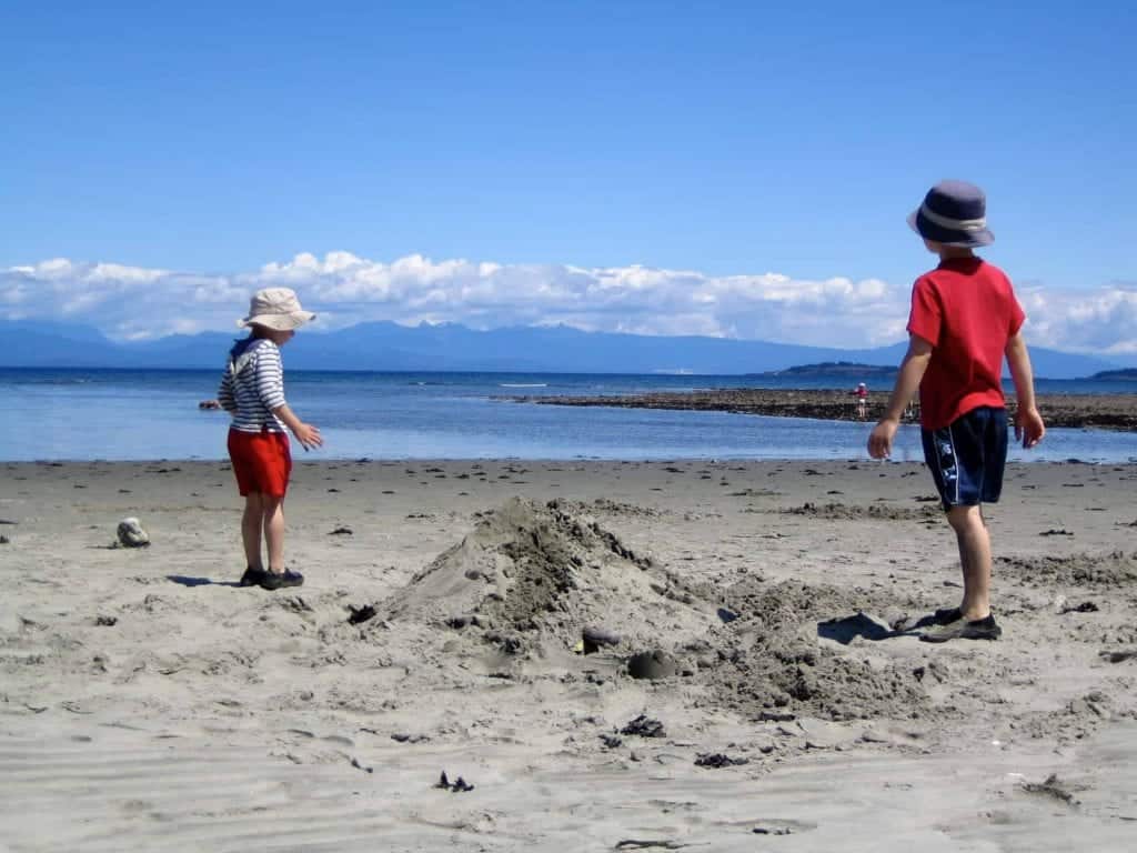 young boys building sandcastles on parksville beach
