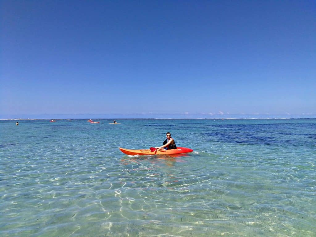 boy in kayak at outrigger fiji resort