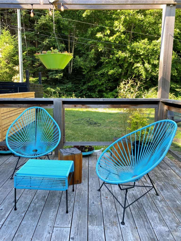 blue patio chairs at woods on pender