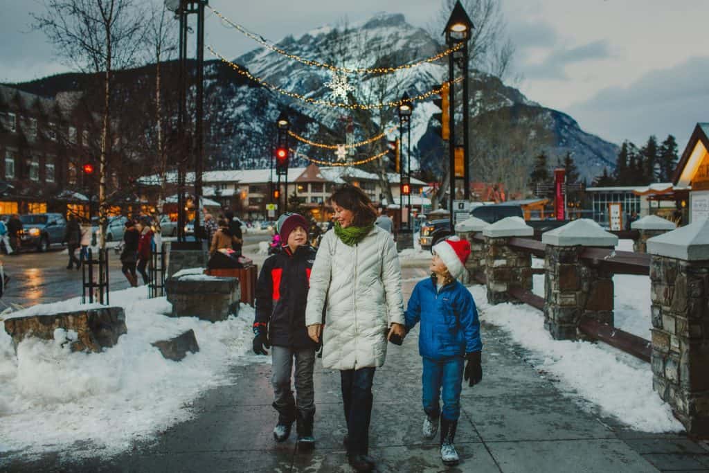 family walking on Banff at Christmas