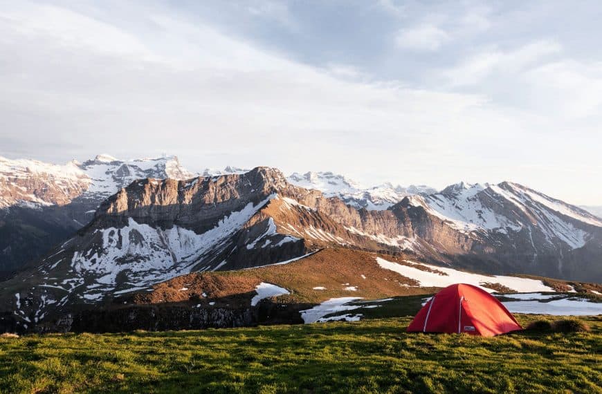 camping tent in bc on grass overlooking mountains