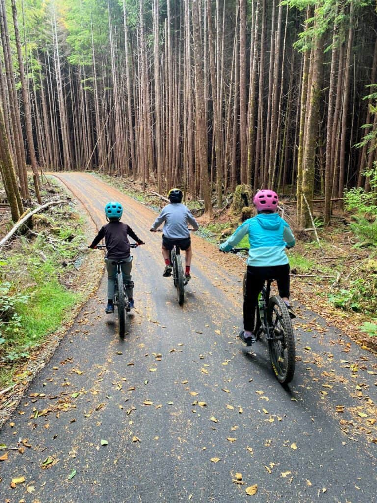 cyclists on tofino pathway